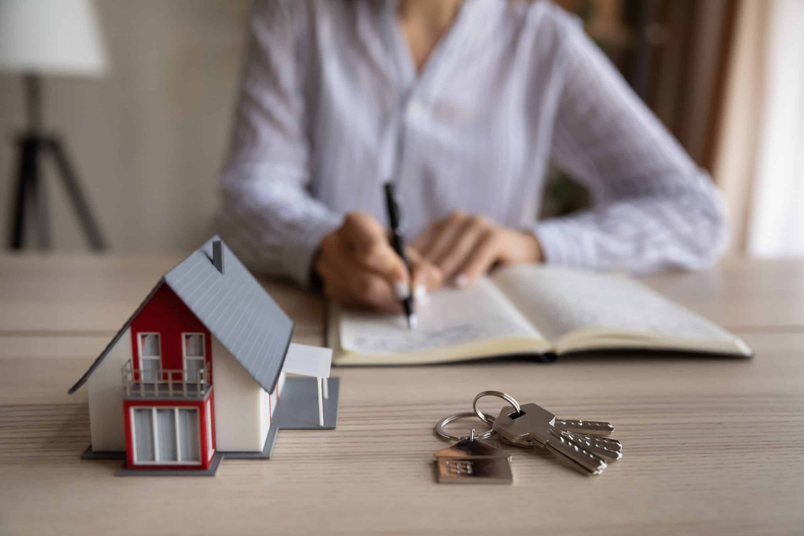 Close,Up,Young,Woman,Handwriting,Notes,In,Paper,Organizer,,Sitting