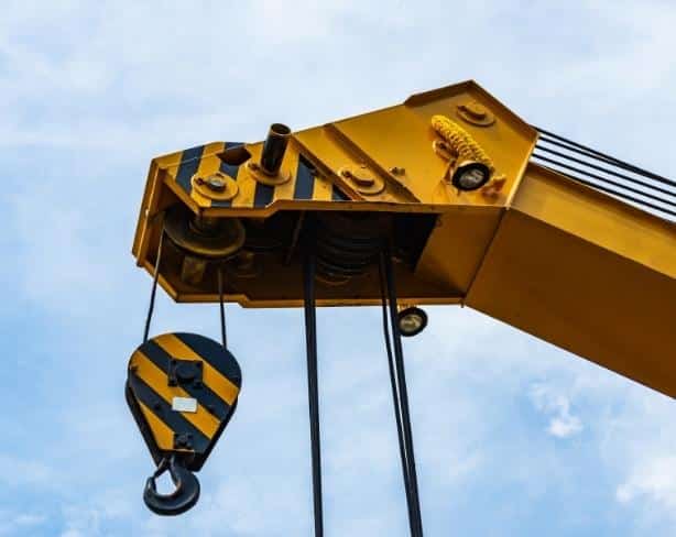 Operating a crane over adjoining properties