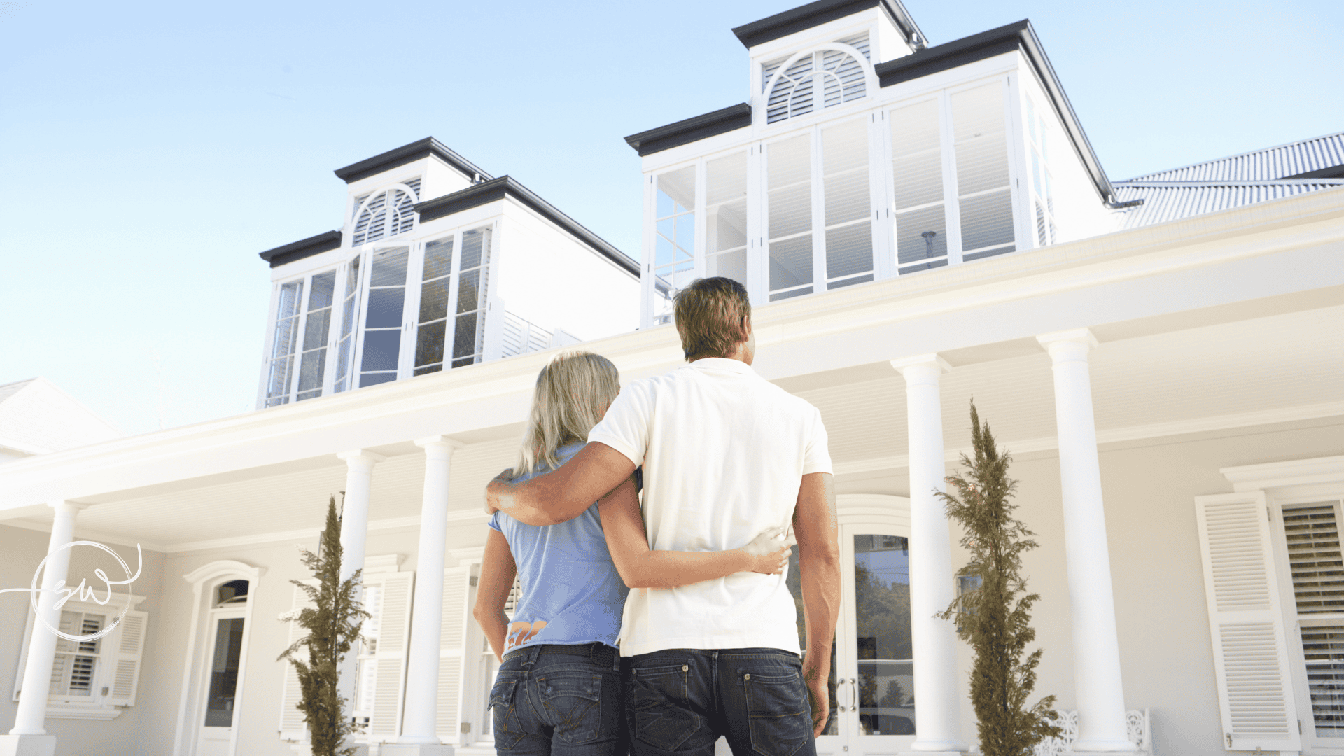 Couple reviewing property ownership documents outside their home in the Sutherland Shire